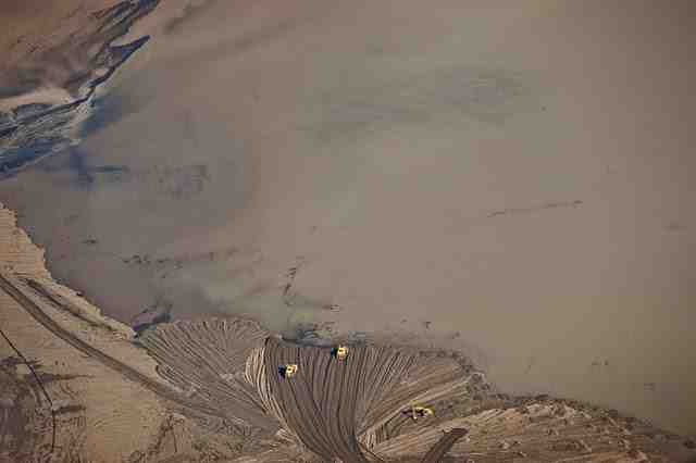 Vehicles at lip of Brushy Fork toxic sludge impoundment near Whitesville, WVa, Nov 09/Carl Galie, flight provided by SouthWings, “Mountaintop removal coal mining,” picasaweb.google.com Vehicles at lip of Brushy Fork toxic sludge impoundment near Whitesville, WVa, Nov 09/Carl Galie, flight provided by SouthWings, “Mountaintop removal coal mining,” picasaweb.google.com