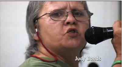 Judy Bonds speaks at local hearing concerning new Massey mining permit, image from video tribute to Judy Bonds, excerpted from “On Coal River”/vimeo.com Judy Bonds speaks at local hearing concerning new Massey mining permit, image from video tribute to Judy Bonds, excerpted from “On Coal River”/vimeo.com