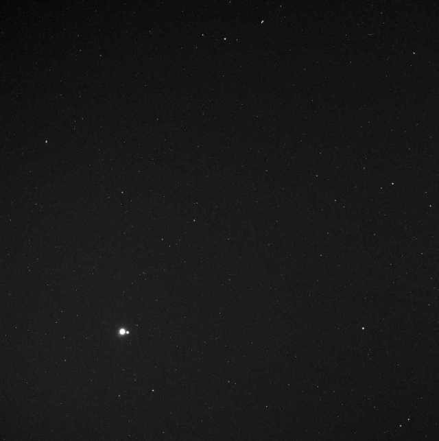 Messenger Spacecraft image of Earth and Moon from 114 million miles away, May 6, 2010/ NASA, Johns Hopkins University Applied Physics Laboratory, Carnegie Institution of Washington, messenger.jhuapl.edu