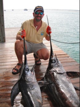 Research scientist David Kerstetter with swordfish caught in Cayman Islands in 2011, undated/David Kirstetter, Nova Southeastern University, MiamiHerald.com