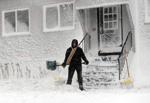 Man shovels snow, Winthrop, MA, Feb 9, 2013/Darren McCollester, Getty, Time