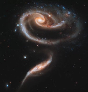 2 spiral galaxies combine / NASA, ESA, CBSNews.com / Click for more.