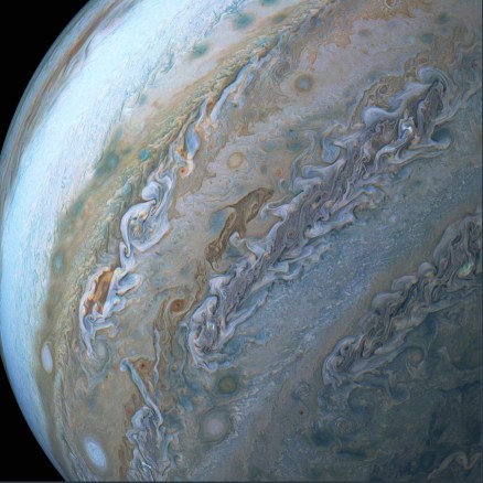 Jupiter cloud formation of dolphin leaping through ocean waves / NASA, SwRI, MSSS, Brian Swift, Seán Doran, Cnet / Click for more.