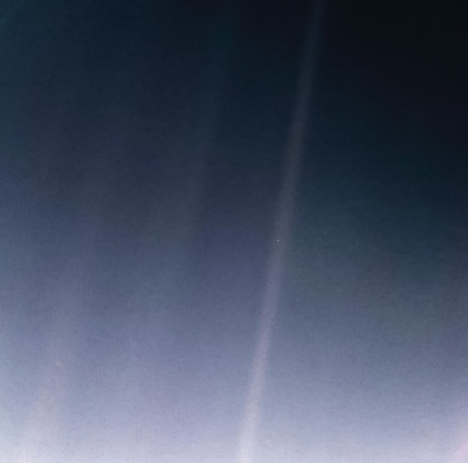 Voyager 1 image of "pale blue dot" of Earth visible in sunbeam, Feb 14, 1990 / Voyager 1, NASA / Click for more. 