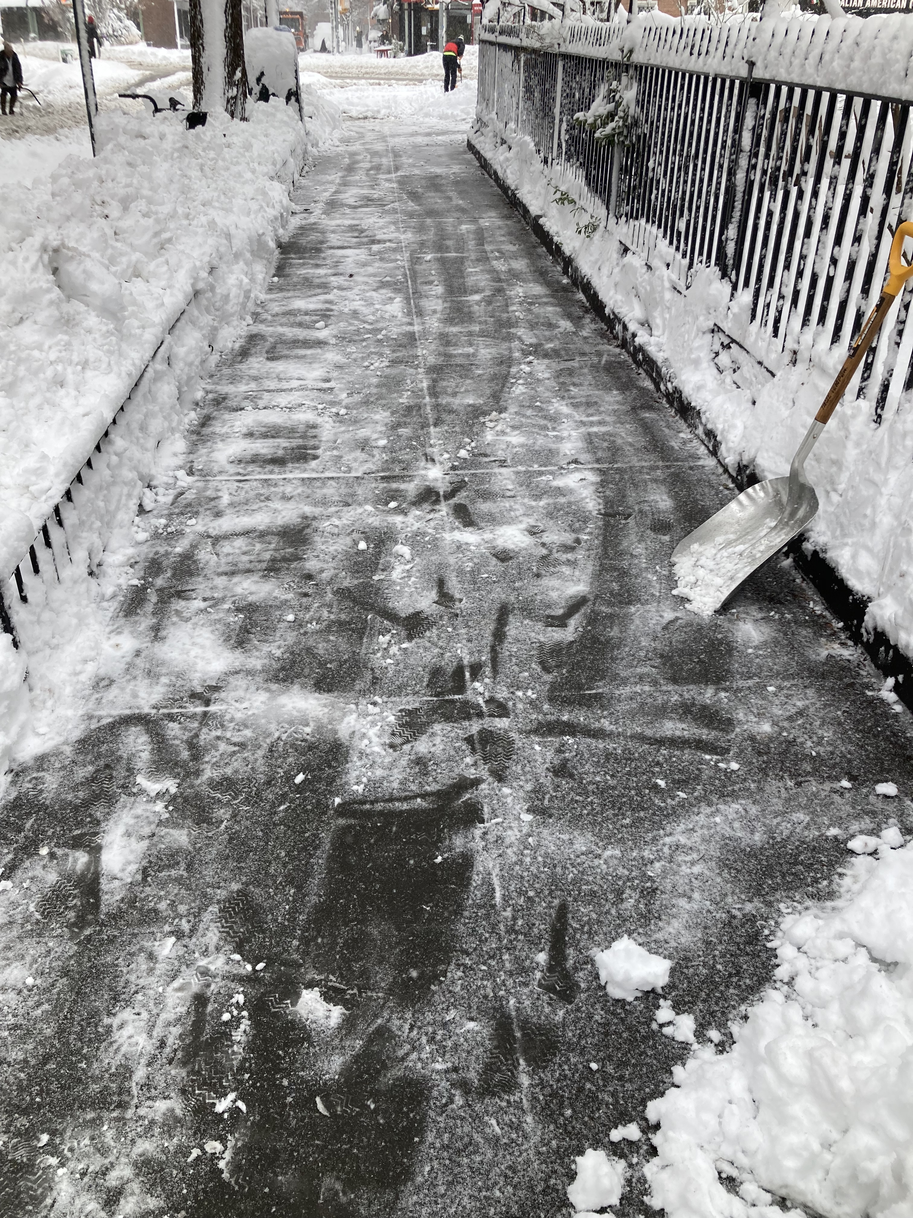 Sidewalk on Jane Street side of Jane Street Garden, Greenwich Village NYC, 1:02 p.m. Monday, February 23, 2026 / Marc Wallace